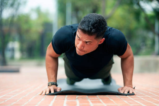 istock Young man exercising outdoors. Sports lifestyle. 1265336245