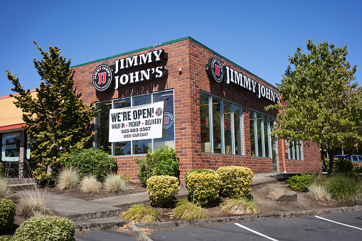 Tigard, OR, USA - Aug 10, 2020: The Jimmy John's franchised sandwich fast food restaurant in Tigard, Oregon, is open for walk-in, pickup, and delivery, during a pandemic summer.