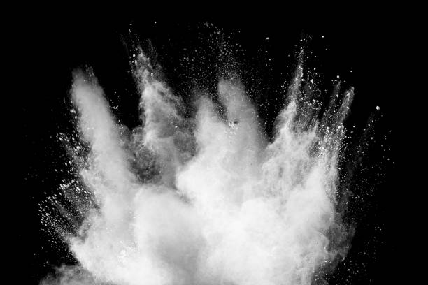istock White talcume powder explosion on black background. White dust particles splash. 1265363699