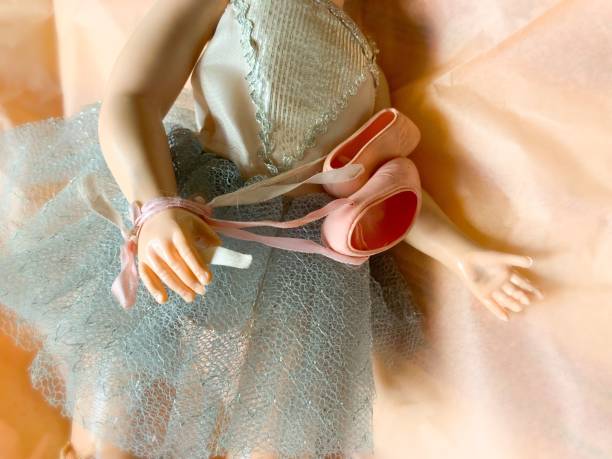 Vintage Ballerina Doll Holding Ballet Slippers.