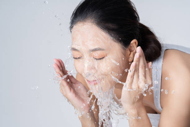 istock Beautiful female asian Wash face in studio 1265391241