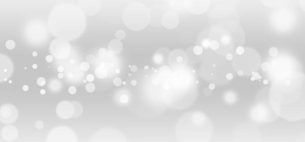 istock White lights bokeh, defocus glitter blur on gray background. illustration. 1265393397