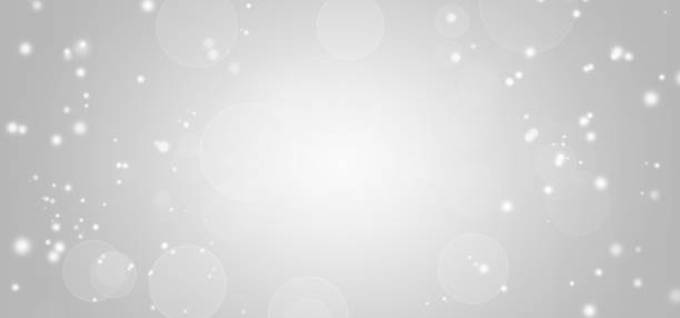 istock White lights bokeh, defocus glitter blur on gray background. copy space. illustration. 1265393404