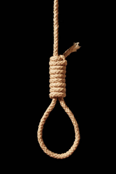 Noose lying on black background. Suicide concept. Hanging. Depression disease.