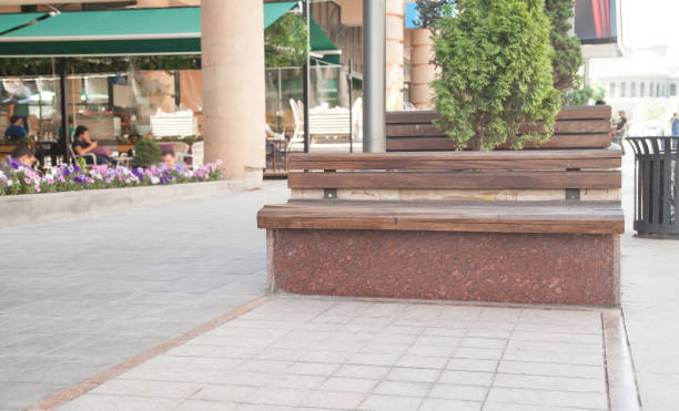 istock Comfortable wooden bench in the city. 1265406936
