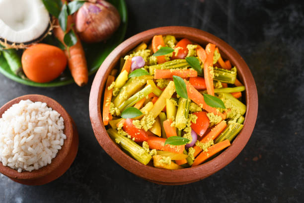 istock Aviyal and rice Kerala mixed vegetable curry with grated coconut 1265410645