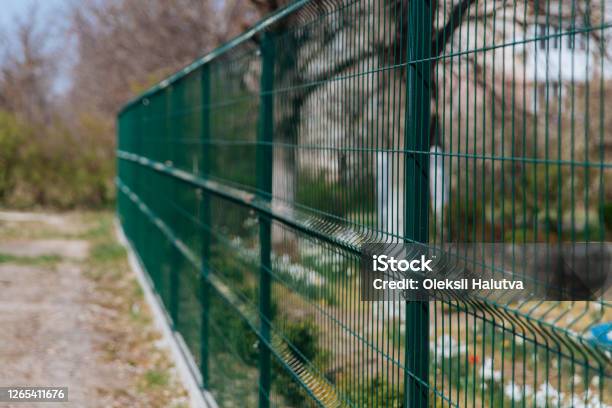 Steel Grill Green Fence With Wire Fencing Stock Photo - Download Image Now - Fence, Control Panel, Grid Pattern