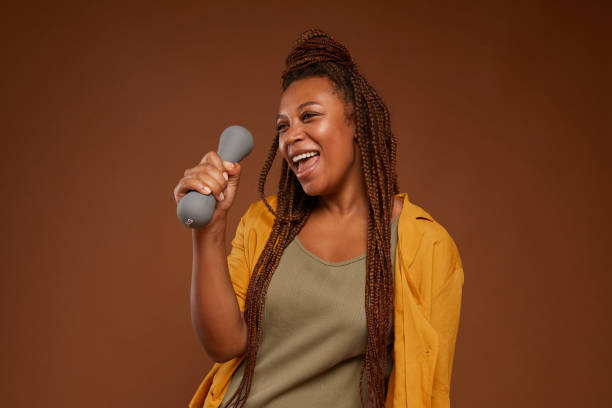 istock Happy woman with dumbbell 1265424200