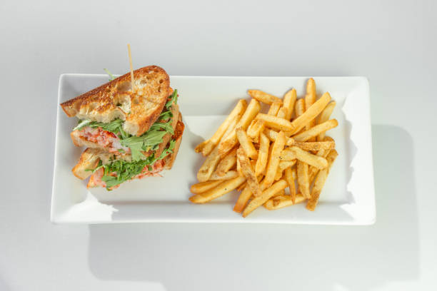 Lobster Grilled Cheese Lobster Grilled Cheese with a side of french fries melting tuna cheese toast stock pictures, royalty-free photos & images