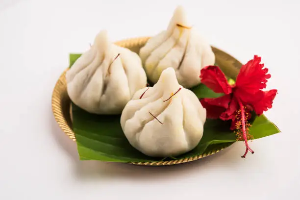 Ukdiche Modak are steamed dumplings with an outer rice flour dough and a coconut-jaggery stuffing, Indian food offered to lord ganesha on Chaturthi