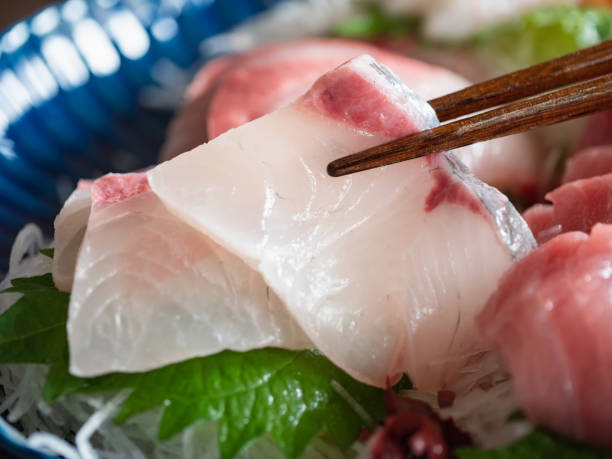 istock Amberjack sashimi and chopsticks close-up. 1265430742