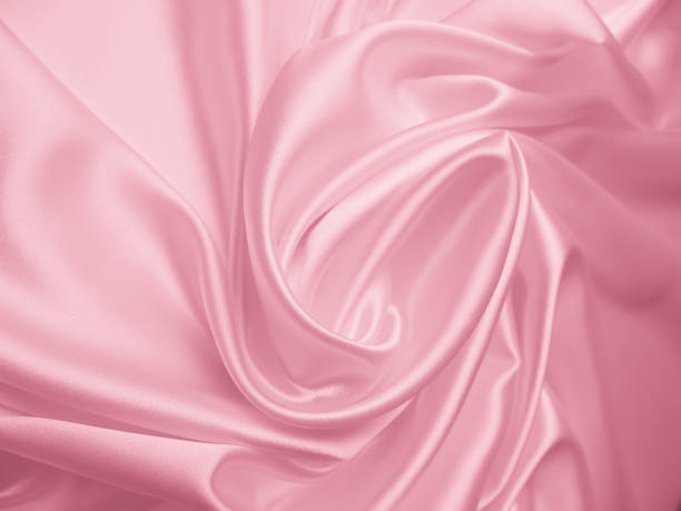 istock Beautiful elegant wavy light pink satin silk 1265432546