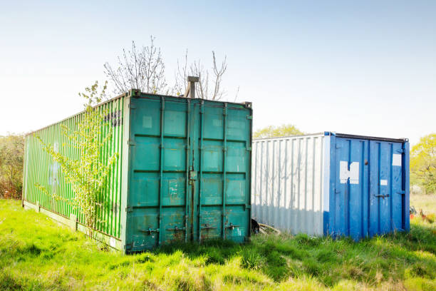 istock metal containers in a field 1265435311