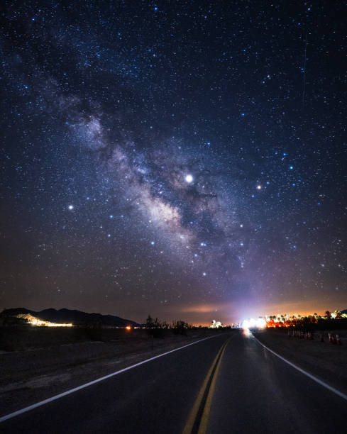 istock Starry night and Milky Way over Death Valley Highway 190 1265435521