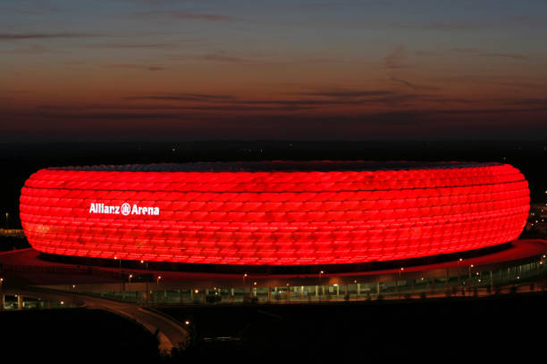 Illuminated Allianz Arena in Munich at night, Bavaria, Germany Germany, Munich football stadium Allianz Arena, 27. April 2007 allianz arena view stock pictures, royalty-free photos & images