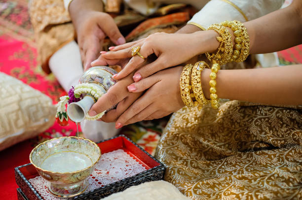 istock pouring holy water in thai wedding 1265436657
