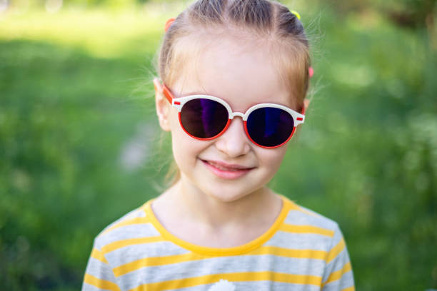 istock Little girl in nice sunglasses 1265438936