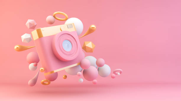 istock pink and gold camera 1265440226