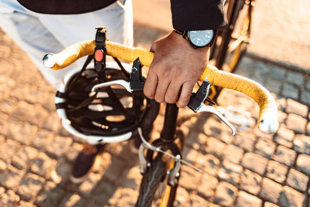 Man pushing bicycle Photo of businessman pushing a bicycle while going to work. top view on people walking and cyclists riding stock pictures, royalty-free photos & images
