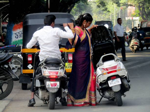 College students greet each other  by touching elbows and seem to be very happy. Schools and colleges set to re open after a long break due to lockdown during Covid-19. Image taken on March 14, 2020 in Maharashtra, India.