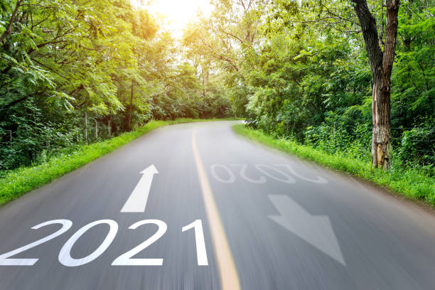 istock Empty asphalt road with Number 2021 and 2020 in motion blur 1265448268