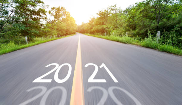istock Blurred road with number 2020 cange 2021 1265449976