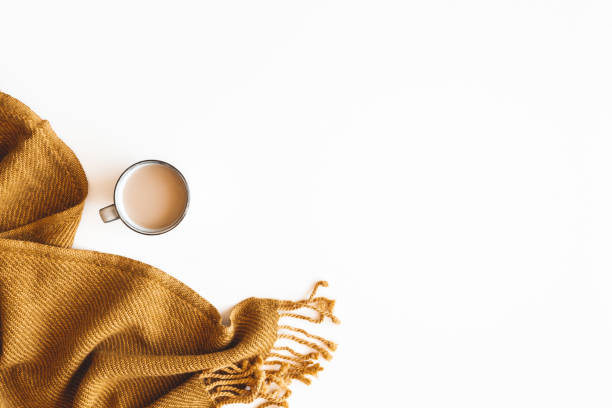 Autumn composition. Cup of coffee, plaid on white background. Autumn, fall concept. Flat lay, top view