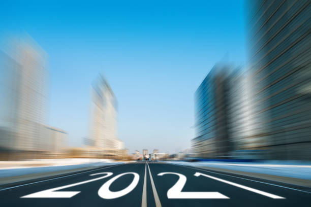 istock Empty street with number 2021 on road in modern city 1265460740