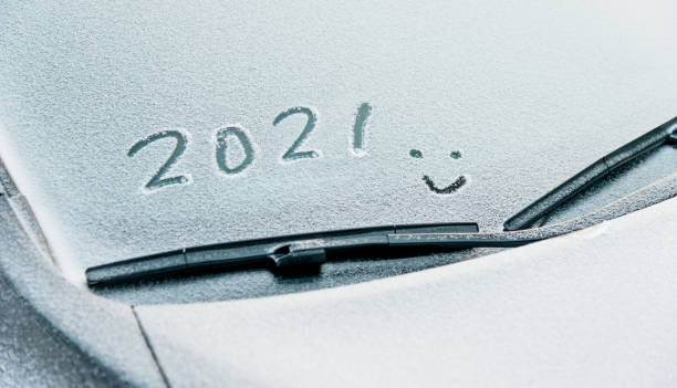 istock New year 2021 written on car windshield 1265461812