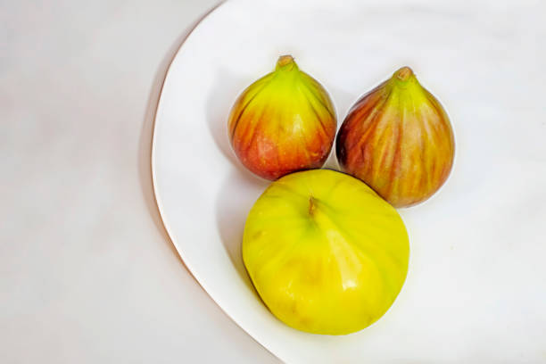 ready to eat fig fruits on white plate