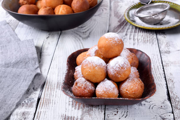 istock Round donuts topped with sugar powder 1265467961