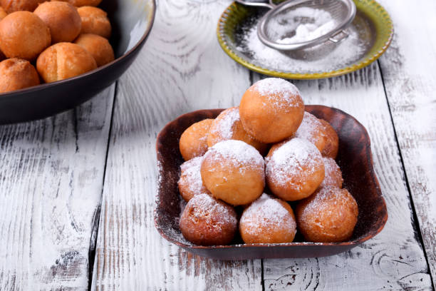 istock Round donuts topped with sugar powder 1265467972