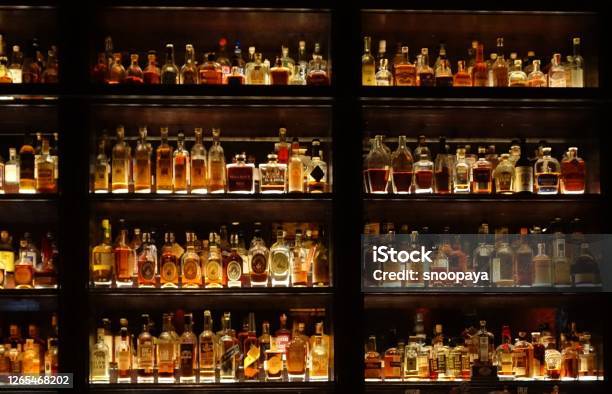 Stylish Wall Full Of Spirit Bottles In A Bar Stock Photo - Download Image Now - Bar - Drink Establishment, Bar Counter, Whiskey