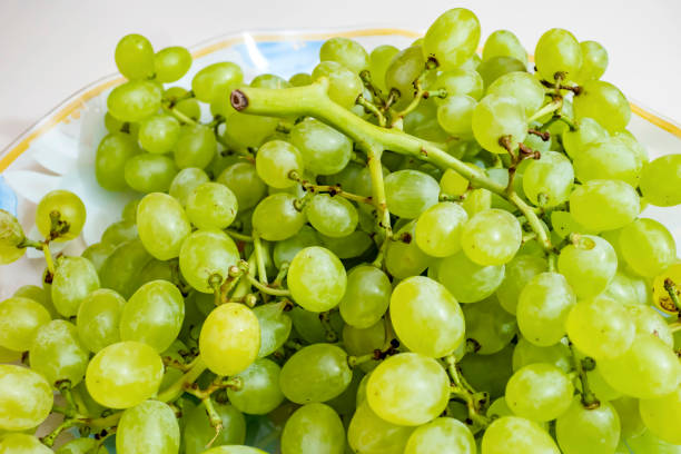 istock close up bunches of white grapes on a plate 1265468211