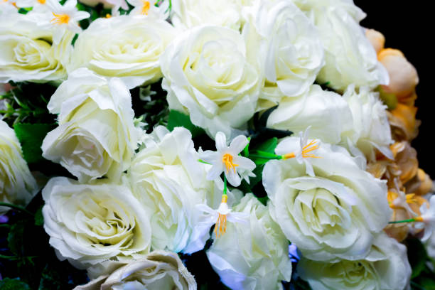 istock Yellow and white artifical paper flower background. Plastic artificial flower. wedding decoration. 1265470551