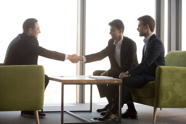 istock Arabian hr manager shaking hand of candidate, greeting on interview 1265470571