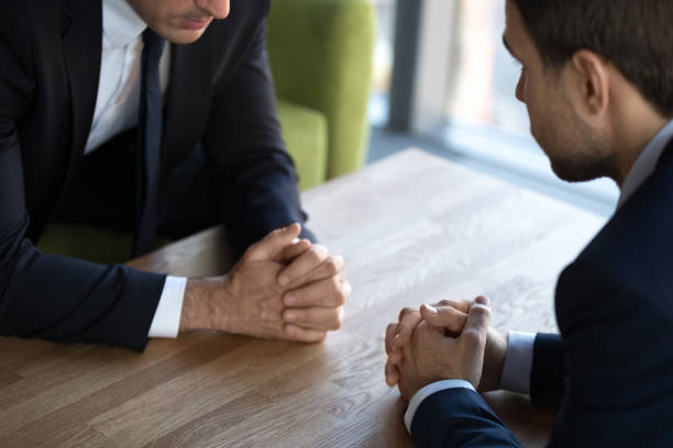istock Close up two businessmen negotiators with clasped hands, debate concept 1265470623