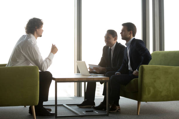 istock Candidate answering smiling hr managers questions in job interview 1265471150