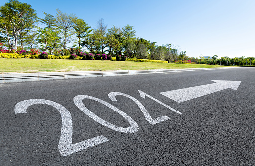 Number 2021 on asphalt road with beautiful roadside scenery