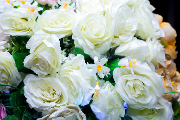 istock Yellow and white artifical paper flower background. Plastic artificial flower. wedding decoration. 1265472477