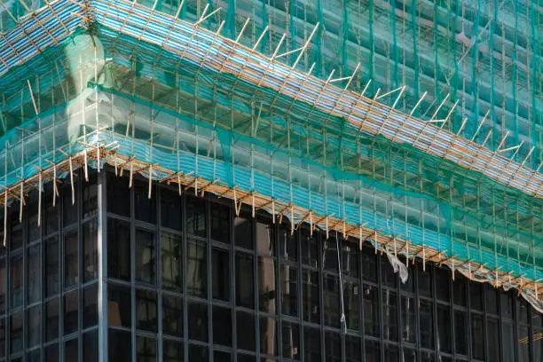 Photo of Bamboo pole scaffolding on building construction site