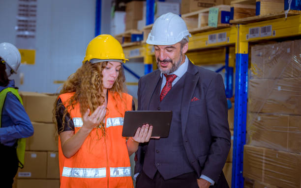 istock Industry engineer and  worker under inspection and checking production process on factory station by tablet .They wearing casual uniform and safety helmet in factory plantation. 1265474161