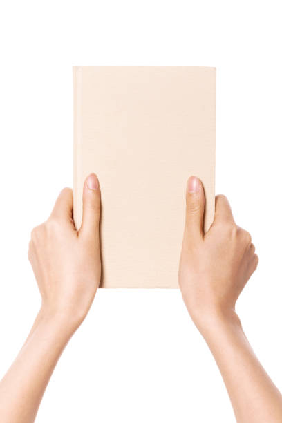 Close up businessman hand reading a magazine.