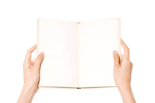 istock woman hand holding book spread horizontal a isolated on white. 1265499269