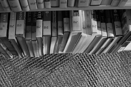 High angle view of books on shelf