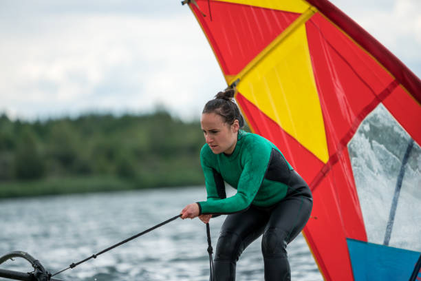 istock Woman learning how to windsurf 1265501542