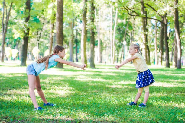 istock Girls excersise in sunshine park 1265503327