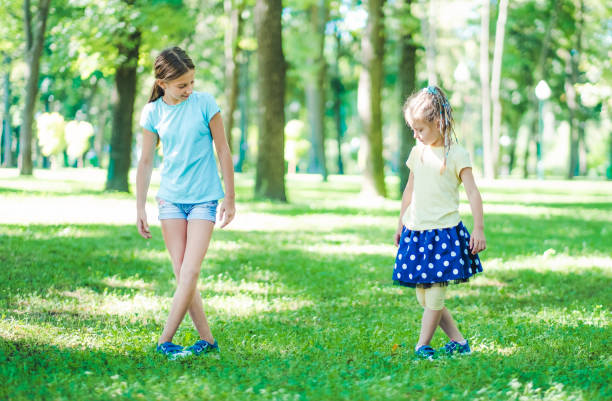 istock Girls standing in dancing position 1265503345