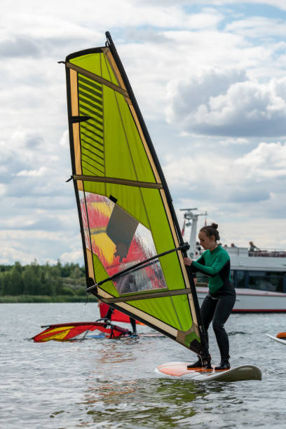 istock Woman learning how to windsurf 1265512130