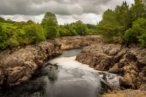 Photo of Water of Ken river flowing through a rocky gorge near Dalry, Galloway, Scotland
